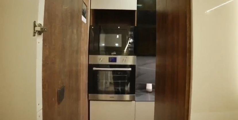 Built-in oven and microwave in timber kitchen